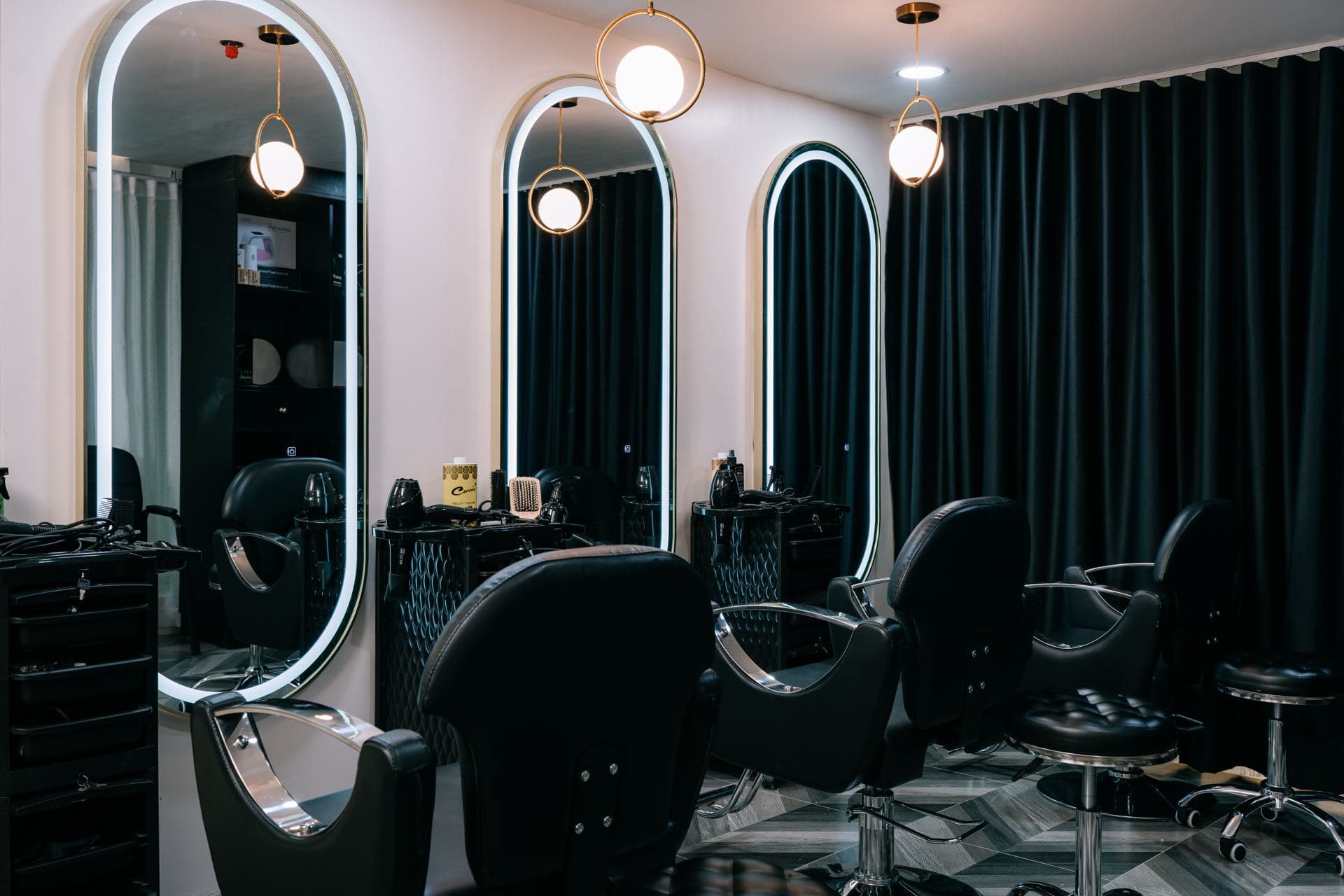 Hair styling studio with arched mirrors and styling chairs