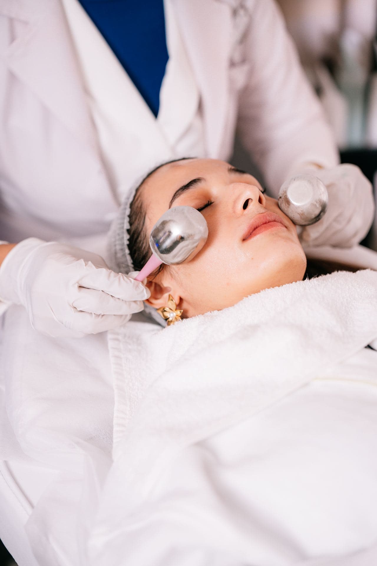 Facial treatment being applied in a bright treatment room